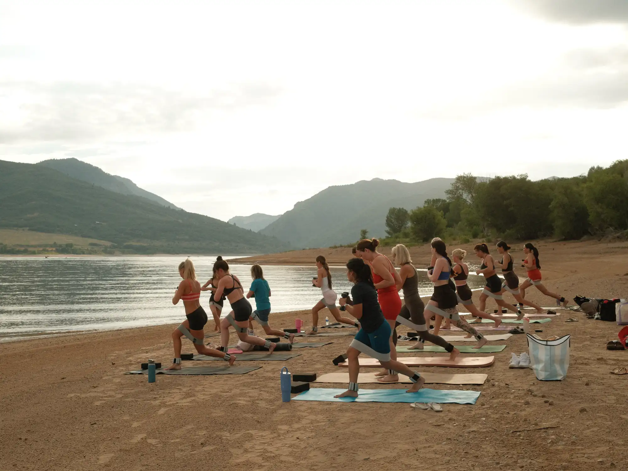 A sculpt mat class mid-flow on the lake shore