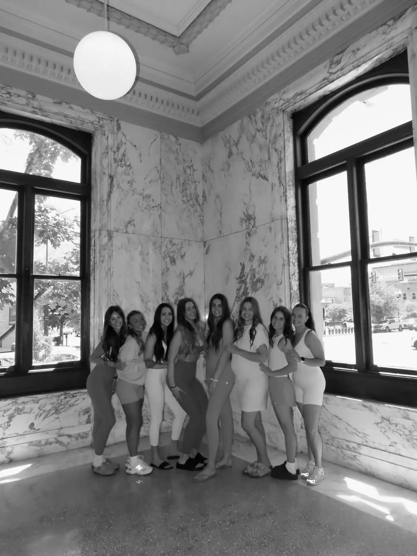 A private event group by a tall window